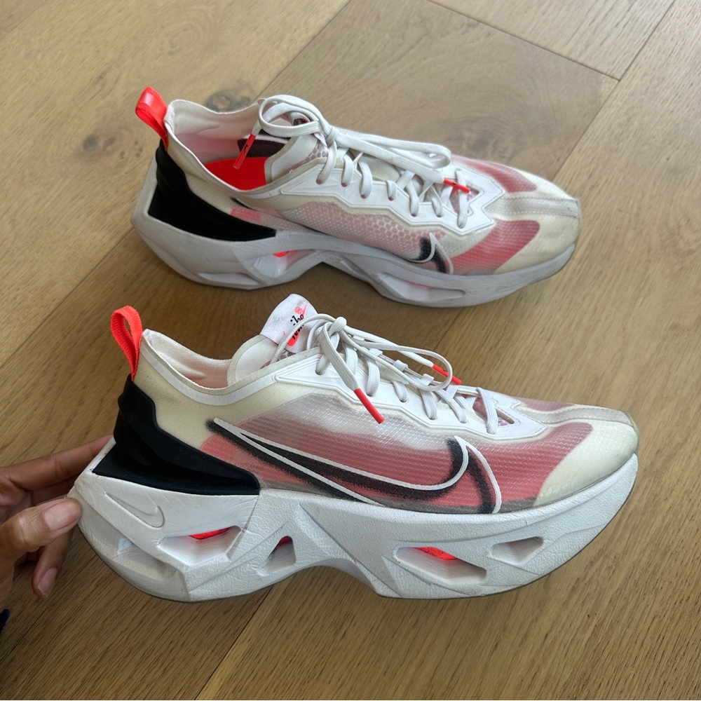 Women’s Nike React Vision trainers in white and pink